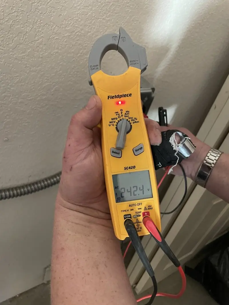 Voltage testing with clamp meter during Ceiling Fan Installation in Lowes Island